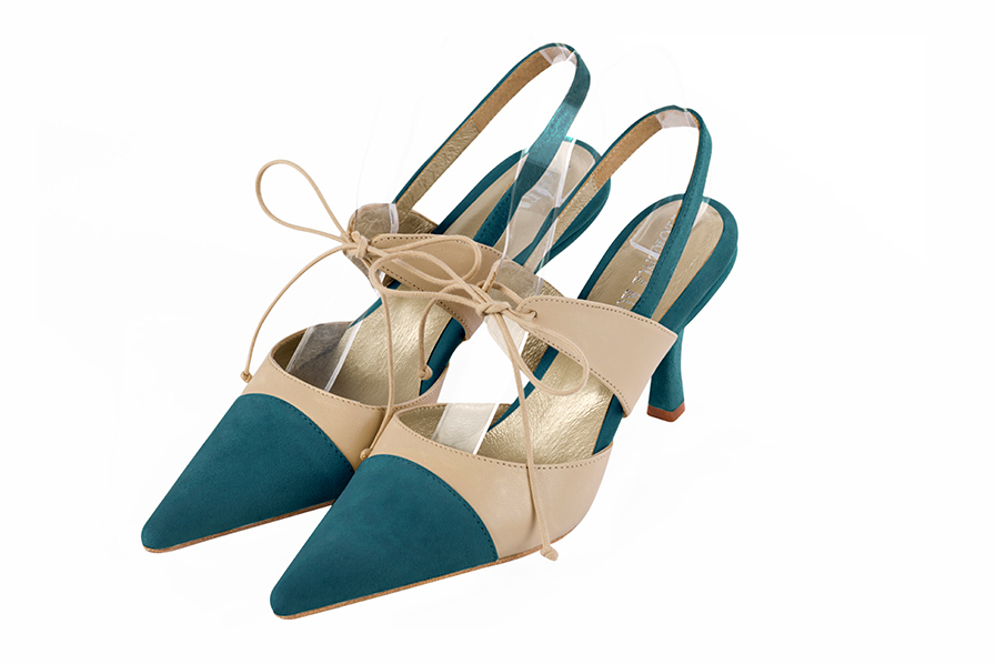 Chaussures habillées, élégantes et raffinées, ouvertes à l'arrière avec une bride sur le cou-de-pied, coloris bleu canard et beige vanille. Bout pointu. Haut. Talon fin. Cérémonie, soirée, cocktail, évènementiel. Personnalisation : Choix des cuirs, 
                des couleurs et des talons. Petites et grandes pointures. - Florence KOOIJMAN